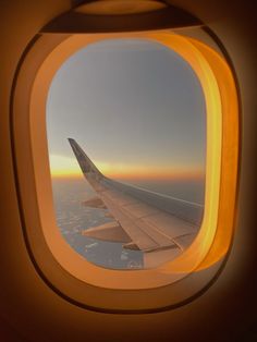 an airplane window looking out at the sky