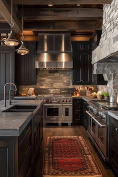 a kitchen with black cabinets and an area rug in front of the stove top oven