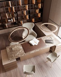 an aerial view of a desk and chairs in a room