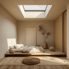 a bed sitting in the middle of a room under a skylight next to a wooden floor