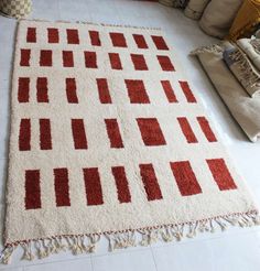 a red and white rug on the floor