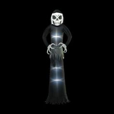 a person in a ghost costume standing with their hands on his hips and head turned to the side