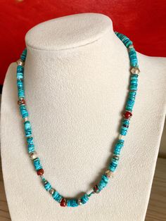 The Turquoise is a beautiful blue similar to Sleeping Beauty, paired with Sterling Silver Beads and Hook Clasp and Natural Coral Inlaid Beads from Nepal. Their is a mix of bead shapes and sizes making this piece rather eclectic, boho and even country western. 18" in length.  I can make in custom length if desired. Send me a message. Southwestern Turquoise Necklace With Colorful Beads, Artisan Blue Turquoise Necklace With Gemstone Beads, Bohemian Blue Turquoise Necklace With Polished Beads, Blue Turquoise Necklace With Silver Beads Artisan Style, Blue Southwestern Jewelry With Colorful Beads, Artisan Blue Turquoise Necklace With Colorful Beads, Adjustable Blue Turquoise Necklace With Silver Beads, Bohemian Blue Turquoise Necklace With Round Beads, Southwestern Style Blue Jewelry With Colorful Beads