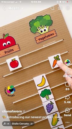 a hand is pointing to an interactive fruit and vegetable matching game on the app store's iphone