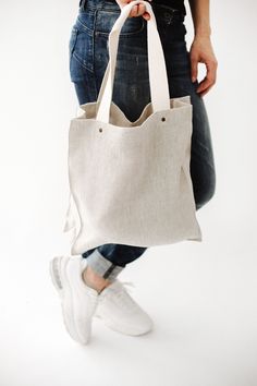 "Natural color pure linen tote bag is perfect for your lunch, goods from shop or market, or even for traveling. The linen fabric is very strong material so it's secure. On the other hand, it's an eco-friendly fabric for food products. ● STRONG and DURABLE MATERIAL. Linen has a value of timelessness, so you can be sure that this organic tote bag is for long use. ● STRONG HANDLES. Handles are with rivets that guarantee safe, secure and long-lasting use. ● INNER POCKET with ZIPPER. Your small thing Linen Tote Bag, Travel Canvas, Linen Bath Towels, Grocery Tote Bag, Market Tote Bag, Market Bags, Grocery Tote, Market Tote, Food Products