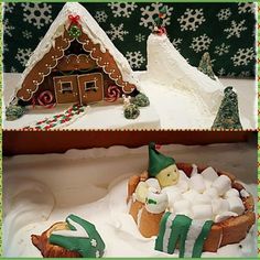 there is a christmas cake with marshmallows in the bowl and a gingerbread house