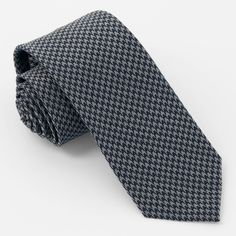 An enduring black houndstooth tie is versatile enough to fit in everywhere from work to a big family event. Black jacket optional.. Loved by GQ Magazine, we've become the go-to destination for cool men's accessories at awesome prices. Shop our selection of premium ties, tie bars, pocket squares, socks, belts, collar bars, collar stays, cufflinks, scarves, lapel pins, shoelaces and suspenders. | Tie Bar: Puppy-Tooth Black Tie - Traditional Ties For Men, Black Standard Tie For Business Casual, Black Suit And Tie Accessories For Business Casual, Elegant Black Ties For Business Casual, Elegant Black Business Casual Ties, Formal Fall Suit And Tie Accessories Standard Tie, Formal Fall Standard Tie Suit Accessories, Formal Fall Standard Tie Accessories, Classic Ties For Formal Occasions In Fall