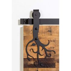 an octopus is mounted to the wall with black iron brackets on it's sides