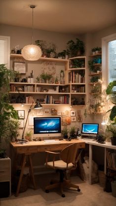 a desk with two computers on top of it next to a plant filled wall in front of a window