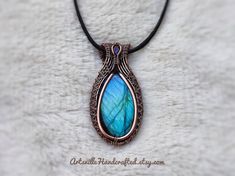 "Labradorite Pendant Necklace, Wire Wrapped Jewelry, Wire Wrapped Pendant, Protection Necklace, Witchy Jewelry, Gift for Her, Crystal Necklace Unique Handmade Artisan Jewelry !! Original Designs by ArtsvilleHandcrafted The pendant is made from pure copper wires and Labradorite stone combination.. Wear this necklace for the healing properties of this amazing stone. Select Necklace Length of your choice !! All Jewelry is nicely packed and dispatched within 1-2 working Days. I love to create beauti Artisan Handmade Teardrop Necklaces, Artisan Handmade Labradorite Necklaces, Handmade Oval Labradorite Necklace, Handmade Artisan Labradorite Jewelry, Handmade Labradorite Round Pendant Jewelry, Handmade Labradorite Teardrop Jewelry, Handmade Teardrop Jewelry, Nature-inspired, Handmade Teardrop Nature-inspired Jewelry, Handmade Nature-inspired Teardrop Jewelry