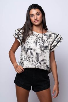 Add a touch of elegance to your wardrobe with our Midnight Meadows Toile Top. Featuring a classic toile design in timeless black and white, and finished with charming ruffle sleeves, this blouse is perfect for any occasion. fill 100% Cotton Import Fit Guide: Libby is 5ft 9 inches; Bust 34”, Waist 25”, Hips 34” Model is wearing a small True to size *available at our bandit location Toile Design, Lavender Brown, Katie May, Kimono Duster, Brown Line, Capri Blue, Mink Pink, Ruffle Sleeves, Blue Moon