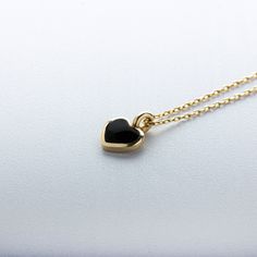 Set on a 14k gold frame, these minimalist heart pendants are available in four stunning enamel colors. You can choose the color in black, yellow, purple or navy blue. You can also complement your favorite heart with yellow, pink or white gold. NECKLACE DETAILS Material:14 carat solid gold Weight: 0.90 grams (with 16 inch chain) Dimensions: 4mm x 5mm Chain: Cable Style: Minimalist Express shipping worldwide 100% Handmade Gift wrapping Yellow and rose gold options are available Please let me know Minimalist Black Heart Necklace For Valentine's Day, Black Necklace For Valentine's Day Gift, Black Enamel Heart Pendant Jewelry Gift, Elegant Black Heart Pendant Charm Necklace, Elegant Black Heart Charm Necklace, Gold Heart Jewelry, Tiny Heart Necklace, Heart Charm Necklace, Heart Pendants