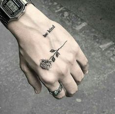 a person's hand with a tattoo on it