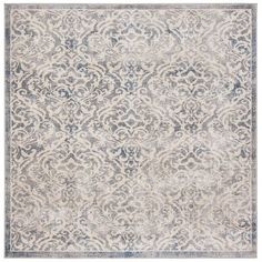 an area rug with blue and white designs on the bottom, in front of a white background