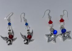 "Handmade earrings I designed and created using lightweight charms in an Americana theme.  I added red and blue Swarovski crystals to them and iridescent Czech glass white beads.  They are securely wire wrapped and suspended from sterling silver ear wires.   Make selection at checkout - this listing is for ONE pair of earrings.      Earrings measure 2\" long" Red Patriotic Jewelry For Independence Day, Red American Flag Jewelry For Independence Day, Patriotic Earrings For 4th Of July, Silver Jewelry For 4th Of July Gift, Silver Jewelry Gift For 4th Of July, Patriotic 4th Of July Earrings, Handmade Patriotic Dangle Earrings, Patriotic Dangle Earrings For Independence Day, Patriotic Handmade Earrings As A Gift