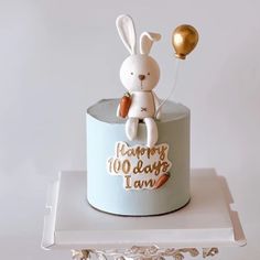 a birthday cake with a rabbit on top