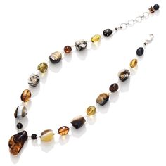 Stunning Amber and Earth-Stones of Agate Designer Necklace The necklace can be purchased with or without the earrings. Each necklace and earrings set is unique one of a kind. Can be layered with other necklaces. Stones: Baltic Amber, Agate (color enhanced) Length: Select from the lengths available (can be adjusted upon request) Center Stone Dimensions for 20-22": Center amber pendent is approx. 1 1/2" long x 1" wide and 1/2" depth (thick) Center Stone Dimensions for 22-24": Center amber pendent Cheap Amber Beaded Necklaces With Polished Beads, Luxury Amber Agate Necklaces, Luxury Amber Oval Beads Jewelry, Luxury Amber Gemstone Beads Jewelry, Silver Statement Necklace, Silver Necklace Statement, Amber Necklace, Necklace And Earrings Set, Amber Stone