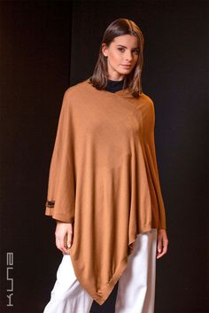 Beautiful and amazingly soft-knitted poncho made from 100% Vicuna. The ultimate in understated luxury. Vicuna is the finest animal fiber in the world. Luxurious Vicuna is extremely light, amazingly soft, and provides unrivaled warmth. This poncho comes in a wooden box and includes a hand-numbered and signed card guaranteeing the fiber came from government-controlled shearing operations. Vicunas may only be sheared every two years and produce a small amount of fiber, increasing the rarity of this Womens Sweater Coats, Alpaca Shawl, Alpaca Coat, Dark Academia Fashion, Nat King Cole, Alpaca Scarf, Academia Fashion, Poncho Tops, King Cole