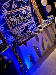 an image of a party with blue lights and decorations on the wall behind it that says, bat mitzma's new york