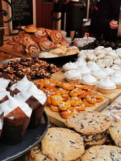 an assortment of pastries and desserts on display