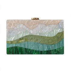 Looking for a unique and stylish piece with a designer touch? You'll love this beautiful Luxury Emerald Striped Acrylic Clutch Bag! With its beautiful pearlescent sheen, this stylish clutch won't go unnoticed. Perfect to dress up an outfit for a party or a wedding. Available with single chain or two chains including a gorgeous green handle, pick your favourite! Style: Eclectic Boho Chic Occasions: Evening, garden party or use as wedding bag Smart features: Hasp closure, cell phone fit, mini hand Summer Formal Green Bags, Summer Event Rectangular Clutch, Elegant Green Summer Bag, Summer Formal Clutch Shoulder Bag, Formal Summer Clutch Shoulder Bag, Summer Event Rectangular Shoulder Bag, Summer Evening Clutch With Pearl Handle, Rectangular Shoulder Bag For Summer Events, Trendy Multicolor Clutch Evening Bag