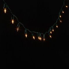 a string of christmas lights is lit up in the dark with no bulbs on it