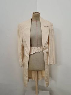 Comme des Garçons evening coat in perfect vintage condition  Trench coat in cream coloured silk From the 80's  Padded shoulders. Very unique exclusive piece  Size M Beige Formal Summer Outerwear, Formal Beige Summer Outerwear, Beige Single Breasted Blazer For Party, Summer Formal Beige Outerwear, Beige Single-breasted Party Blazer, Summer Cream Formal Blazer, Summer Formal Cream Blazer, Chic Beige Wedding Blazer, Chic Beige Blazer For Weddings