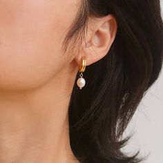 Add a touch of elegance to your everyday look with our Charlotte Freshwater Pearl Drop Earrings. These timeless beauties feature high-quality freshwater pearls hanging from 18K plated gold stud, perfect for any occasion. Elevate your style and feel confident with these simple yet classic earrings. To keep your jewellery in the best condition, we recommend giving it a good care over time. By using a soft, lint-free jewellery cloth, you can remove blemishes that result from body oils, perfumes and lotions. Also remember try not to expose your jewellery in the open air. Our branded dusty bag or your jewellery box will keep them last longer. If you go to gym or spa, remember to take them off, because water or sweat will also damage them. Freshwater Pearl Drop Earrings, September Birthstone Jewelry, August Birthstone Jewelry, July Birthstone Jewelry, Body Oils, Classic Earrings, Pearl Jewellery Earrings, Jewelry Ring Box, Gold Stud