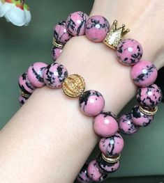 Material:pink rhodonite beads  size :13-13.5mm   quantity: one strand  6mm approx 29 pcs one strands 7mm approx25 pcs one strands 8mm approx 22 pcs one strands 9mm approx 21pcs one strands 10mm approx 19 pcs one strands 11mm approx 18pcs one strands 12mm approx 16 pcs one strands 13mm approx 16 pcs one strands 14mm approx 15 pcs one strands 15mm approx 14pcs one strands 16mm approx 14 pcs one strands 17mm approx 13pcs one strands 18mm approx 13pcs one strands 19mm approx 12pcs one strands 20mm a Pink Opal Round Beads Bracelet, Pink Gemstone Beads Bracelets With Round Beads, Pink Gemstone Beads Bracelets, Pink Gemstone Beads Bracelet, Pink Round Beads Bracelets With Natural Stones, Pink Natural Stones Round Beads Bracelets, Pink Beaded Bracelets With Natural Stones, Pink Natural Stone Beaded Bracelets, Pink Natural Stones Beaded Bracelets