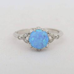 Vintage Sterling Silver Blue Opal & White Topaz Ring ...Marked 925...Total of weights 2.0grams...Size 9...Measure of Face 9.2MM...It's in very good condition. Topas Ring, Opal White, Topaz Ring, Blue Opal, Silver Blue, White Topaz, Solitaire Ring, Sterling Silber, Vintage Sterling Silver