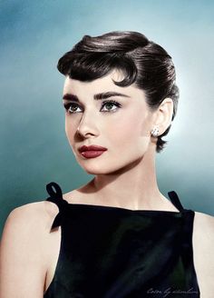 an old photo of a woman wearing a black dress and pearls on her head, in front of a blue background