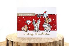 a christmas card with reindeers on it