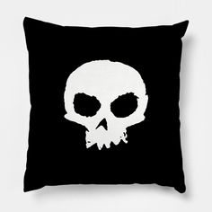 a black pillow with a white skull on it