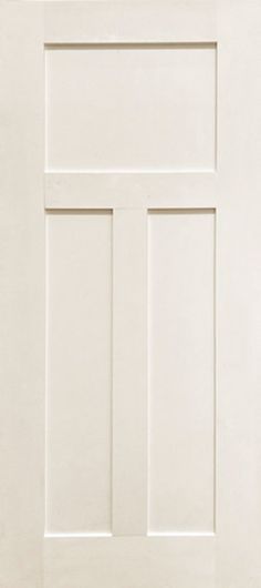 a white door with two square panels on the side