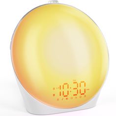 the alarm clock is yellow and white with orange numbers on its face, as if it were an electronic device