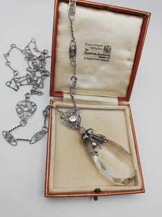 Please check my own website at www.elegantium.co.uk for my best prices :-) This is such a fabulous, early piece of c1900 English Arts and Crafts jewellery, with the most attractive leaves and berries design on the crystal drop, as well as the most wonderful detailing on the original sautoir chain. Clearly, all hand-constructed, every twist of the silver links, every oval openwork panel with coils and every hammered disc used in the design. A lovely piece in every sense. I have not been able to a Silver Drop Necklace For Evening, Silver Drop Necklaces For Evening, Vintage Drop Necklaces For Wedding, Antique Drop Necklaces For Formal Occasions, Victorian Silver Drop Jewelry, Vintage Silver Drop Jewelry, Silver Drop Necklace With Jewels, Silver Briolette Drop Necklace For Formal Occasions, Silver Necklaces With Rose Cut Diamonds