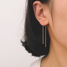 Great quality ear threader earrings, 18K gold plated brass, color not easily tarnish, lead nickel free. Color: gold Material: gold plated brass Size: 114mm, pin 0.85mm, chain 1.2mm,loop 2.5mm (see Pic 2) Quantity: 10 pcs=5 pairs More gold findings here: https://www.etsy.com/shop/Nbeads?ref=seller-platform-mcnav&search_query=GB Ear Threader, Threader Earrings Gold, Earrings Chain, Thread Earrings, Beading Needles, Threader Earrings, Ring Dainty, Dainty Earrings, Earring Findings