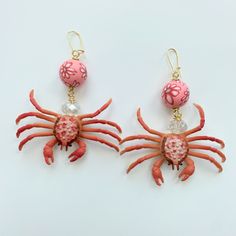 "Beach vacation-ready crab statement earrings in a chic summer pink palette.  Miniature pink crabs dangle with faceted crystal beads and floral fimo beads to create the perfect summer earring. Gold-plated, nickel-free ear wires. 3.25\" drop. If you love accessorizing for the occasion, then you need these crab earrings for your next beach party, beach vacation, seafood boil dinner party, or clambake! Makes a great gift or something special to treat yourself! Thanks for looking!" Boil Dinner, Crab Earrings, Byzantine Gold, Fimo Beads, Pink Palette, Seafood Boil, Earring Gold, Summer Earring, Plastic Jewelry