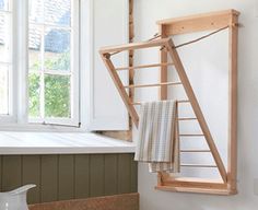 a kitchen with a sink, window and towel rack