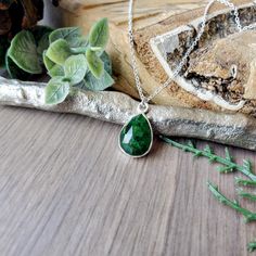 Like the alluring emerald, the recently-discovered gemstone chrome diopside boasts a mesmerizing deep green. This precious stone gets its color from the mineral chromium.  Made up of a genuine 14x10mm Chrome Diopside  gemstone faceted set in a Sterling Silver 19x10.5mm pendant hung from a Sterling Silver chain.  Because these are a beautiful natural stone, no two are exactly alike.  ✭ CUSTOMIZE YOUR PIECE ✭ ►  Don't see the length you need? Check out our Custom Length Upgrade:  https://www.etsy. Gift Emerald Green Necklace With Natural Stones, May Birthstone Emerald Necklace With Natural Stones, Emerald Necklace With Natural Stones For May Birthstone, Green Tsavorite Emerald Necklace, Green Tsavorite Gemstones For Gifts, Green Faceted Emerald Necklace Gift, Faceted Green Gemstones Gift, Green Gemstones For May Birthstone Gift, Green Emerald Teardrop Pendant Necklace