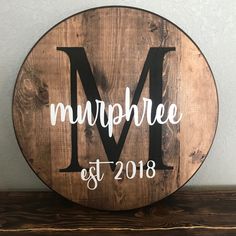 a wooden sign with the word mr and mrs painted on it's side, sitting on top of a shelf