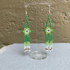 Handmade With Czech Glass Seed Beads And 925 Sterling Silver Hooks By A Young Chicana Artist. Please Allow 2 Weeks To Be Made And Shipped. Some Flexibility With Colors, Comment For Any Questions! Make A Bundle Of 3 For Free Shipping Green Sterling Silver Flower Earrings, Elegant Adjustable Flower Shaped Beaded Earrings, Traditional Dangle Jewelry With Bead Caps, Handmade Green Flower Earrings In Sterling Silver, Handmade Green Sterling Silver Flower Earrings, Colorful Beaded Flower Earrings For Gift, Sterling Silver Jewelry With Green Dangling Beads, Green Sterling Silver Dangle Flower Earrings, Green Sterling Silver Flower-shaped Earrings