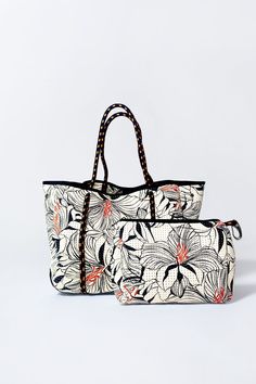 Introducing our exclusive Hibiscus Tote + Pouch Set Bundle – a fusion of tropical allure and practical elegance. Immerse yourself in the vibrant beauty of hibiscus blooms with our meticulously designed tote, adorned with stunning floral patterns that evoke a sense of exotic charm. The accompanying pouch, crafted with the same attention to detail, adds a touch of versatility to your ensemble. Casual Travel Bag With Removable Pouch, Casual Reversible Summer Bag, Chic Travel Beach Bag With Removable Pouch, Chic Beach Bag With Removable Pouch For Travel, Casual Weekender Bag With Removable Pouch, Casual Rectangular Travel Bag For Vacation, Vacation Bag With Luggage Sleeve, Travel Tote Beach Bag With Removable Pouch, Versatile Beach Tote Bag With Removable Pouch