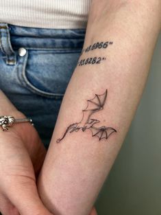 a woman with a tattoo on her arm holding onto another person's arm and the words,