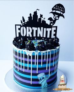 a birthday cake with the word fortnite on top and dripping icing from it