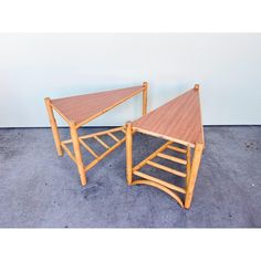 two wooden tables sitting next to each other