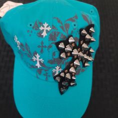 Turquoise Studded Cross Adjustable Hat Trendy Blue Hats For Festival, Trendy Blue Hat For Festival, Trendy Green Hat For Festival, Trendy Green Hat For Festivals, Trendy Green Festival Hat, Turquoise Casual Adjustable Hat, Casual Adjustable Turquoise Hats, Casual Adjustable Hats As Fashion Accessory, Casual Turquoise Brimmed Hat