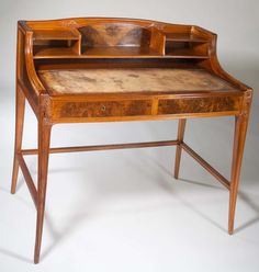 an old wooden desk with drawers on it