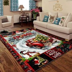 a living room with couches and christmas decorations on the rug in front of it