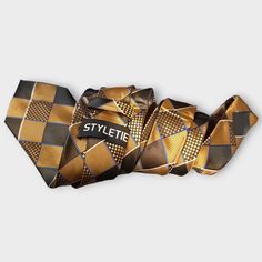 The tie features a classic plaid pattern that is both stylish and versatile, making it perfect for any formal occasion. The pocket square is the perfect coordinating accessory to complete your look. And the gold cufflinks add a touch of sophistication and elegance to your outfit. 100% Silk Handmade Package Includes: Tie, Pocket Square & Cufflinks. Length: 59" Width: 3.34" Warm iron if needed Classic Brown Suit And Tie Accessories For Father's Day, Gold Suit And Tie Accessories For Business, Elegant Gold Rectangular Suit And Tie Accessories, Luxury Gold Suit And Tie Accessories For Formal Occasion, Dapper Gold Tie For Business, Dapper Gold Accessories For Black Tie Suit, Classic Gold Ties For Father's Day, Classic Gold Tie For Father's Day, Luxury Gold Tie For Formal Occasions